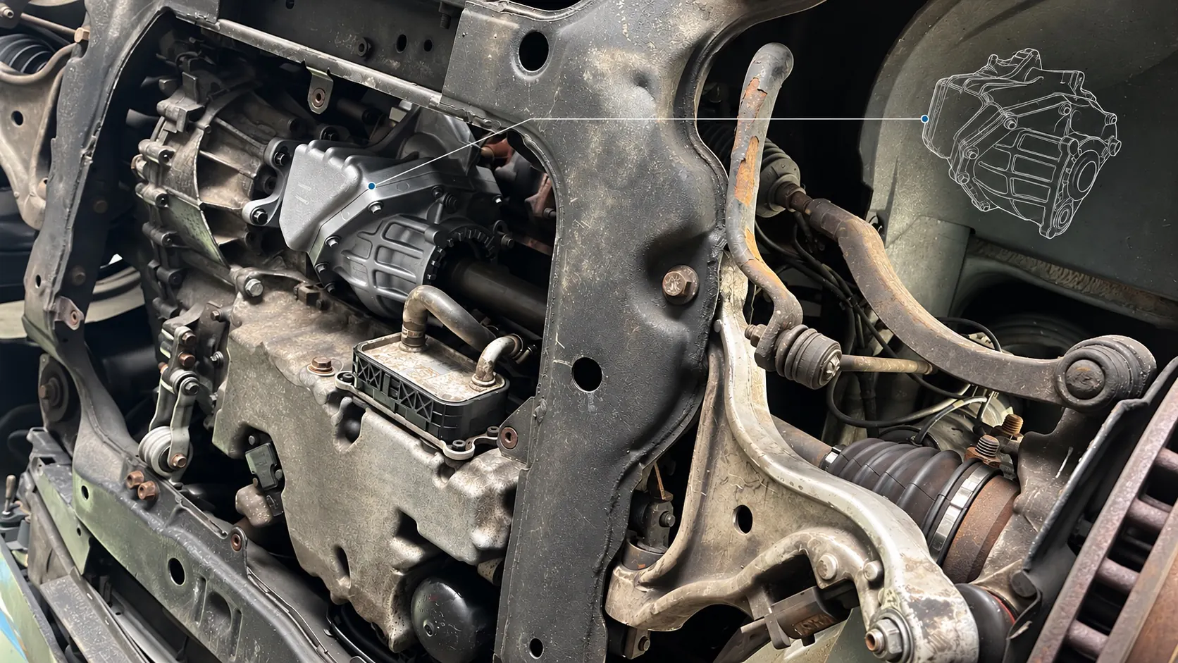 Onderzijde van de Volvo V70R met de gemonteerde haakse overbrenging, naast het subframe en de wielophanging